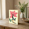 Egret in Bloom portrait greeting card featuring a black-and-white bird and bold pink flower.