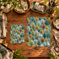 Woodland Wanderers printable papers in two sizes displayed on a wooden crafting table.